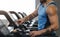 Athlete turning on modern treadmill at gym, panorama