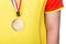 Athlete wearing generic gold medal with ribbon on his neck