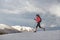 Athlete woman runs on the snow for skyrunning practice