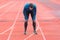 Athlete young man tired, resting on running track.