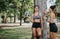 Athletes Enjoying a Conversation Outdoors After Training in the Park