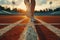 Athletes feet in running shoes on stadium starting line, poised