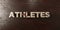 Athletes - grungy wooden headline on Maple - 3D rendered royalty free stock image