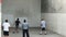 Athletes play three wall handball at Venice Beach