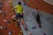 Athletes rock climbing in fitness studio