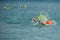 Athletes swimming free style in the sea during triathlon competition. Swimmer in the ocean