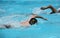 Athletes swimming on a swimming-pool