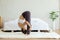 Athletic Asian woman practice yoga Spread foot stretching pose or Prasarita Padottanasana pose