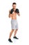 Athletic attractive man wearing boxing gloves on the white