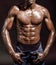 Athletic black man on black background