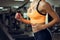 Athletic blond woman running on treadmill at gym.