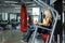 Athletic blonde woman using press machine in gym