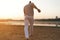 Athletic capoeira performer making movements on the beach