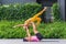 Athletic couple practicing acro yoga or yoga partner together in fitness park