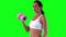 Athletic female exercising with dumbells