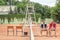 athletic friends with wooden rackets sitting on chairs