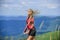 Athletic girl enjoy trekking. Vacation ideas. Healthy lifestyle. Sporty tourist hiker trekking. Summer tourism. Woman