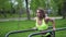 Athletic girl exercise the triceps on parallel bar