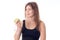 Athletic girl standing sideways squeezing an apple in her hand