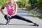 Athletic girl warming up before jogging