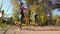 Athletic girls cycling on exercise bikes on sports ground