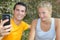 Athletic healthy cheerful couple making selfie after training