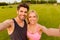 Athletic healthy cheerful couple making selfie after training