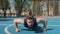 Athletic lebanese bodybuilder man in sportswear doing sport workout push-up exercise from ground