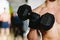 Athletic male with dumbbells workout