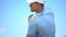 Athletic male golfer suffering terrible pain in shoulder, sport and health