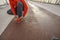 Athletic man bending over an untied shoelace