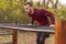 Athletic man doing pullups outdoors