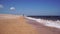 Athletic Man is Doing Sports, Running along Sea Coast on Beach in Summer