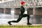 Athletic man doing stretching exercises, outdoor. Active male working out outside on the background of the bridge