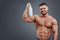 Athletic Man Fitness Model holding bottle