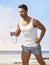 Athletic man jogging on the beach