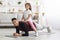 Athletic man planking with little girl on his back