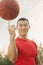 Athletic Man Spinning Basketball and Looking at Camera