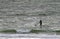 Athletic man on a stand up paddle board in the beach at island of Sylt, Germany