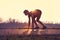 Athletic man starting evening jogging in sun rays