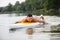 Athletic man swimming on a paddleboard