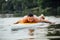 Athletic man swimming on a paddleboard