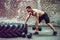 Athletic man working out with a dumbbell. Strength and motivation. Exercise for the muscles of the back