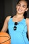 Athletic Minority Female Basketball Player Smiling