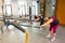 Athletic multinational people doing exercise with elastic rope in gym