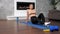 Athletic muscular girl sportswoman does exercise at home in living room
