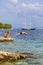 Athletic older man jumping into the water in the Adriatic Sea, Vis, Croatia