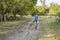 athletic senior man is riding a folding bike in Nebraska National Forest