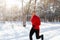 Athletic senior man in sportswear running at winter park, jogging outdoors on frosty sunny morning, copy space