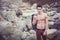 Athletic shirtless young man outdoor at river or water stream